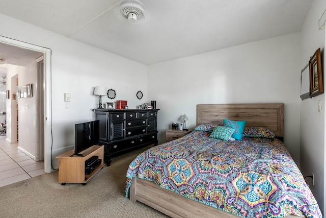 bedroom with visible vents and carpet