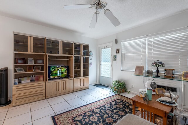 dining area featuring light tile patterned floors and ceiling fan with notable chandelier