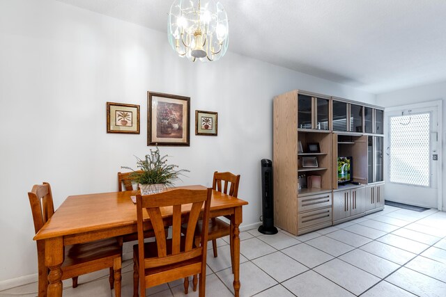 kitchen with tile counters, sink, backsplash, white appliances, and light tile patterned floors