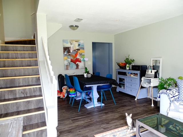 dining room featuring dark hardwood / wood-style flooring