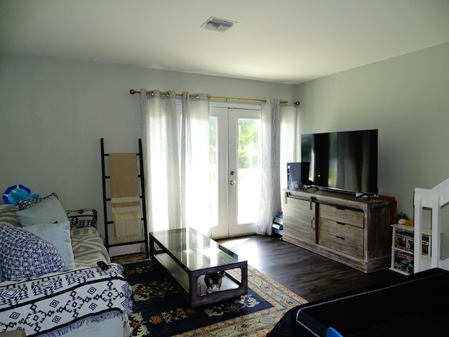 bedroom featuring access to exterior, french doors, and dark wood-type flooring