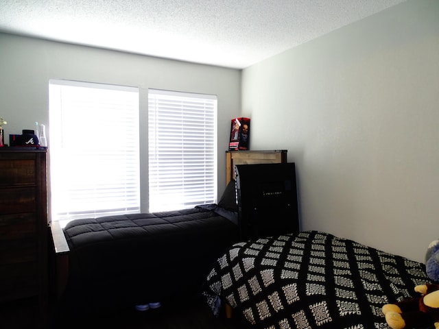 bedroom featuring a textured ceiling