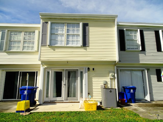 rear view of property with central air condition unit