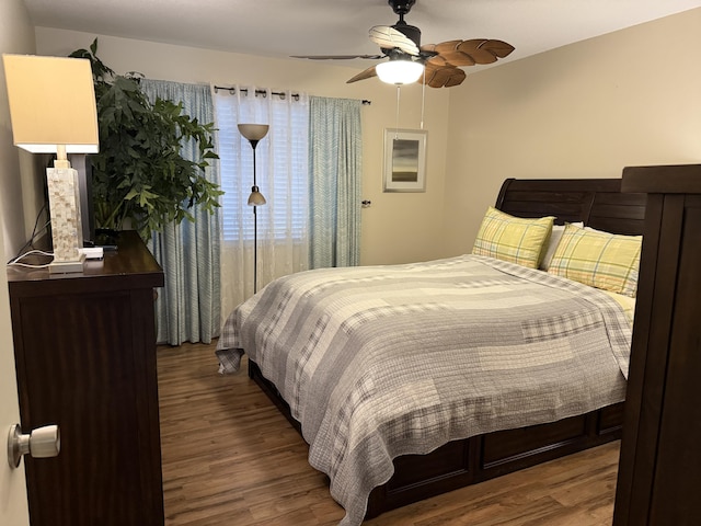 bedroom featuring hardwood / wood-style flooring and ceiling fan