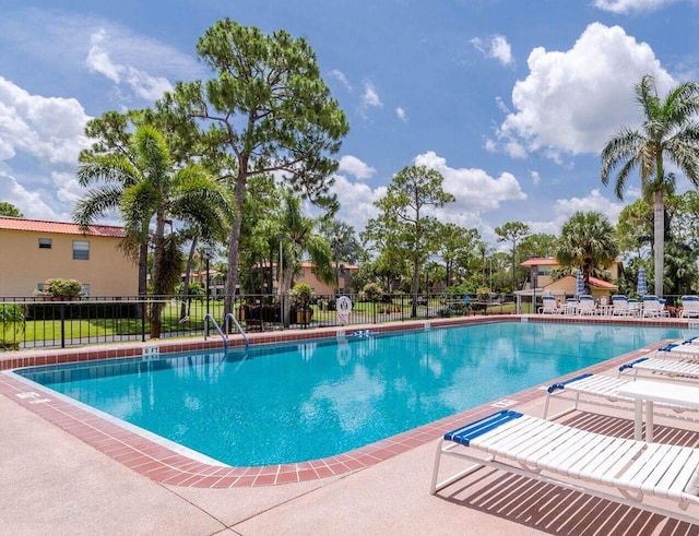 view of swimming pool with a patio area