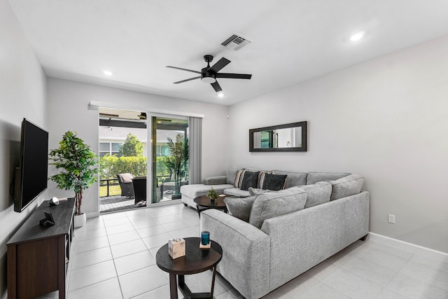 living area with light tile patterned flooring, recessed lighting, visible vents, baseboards, and a ceiling fan