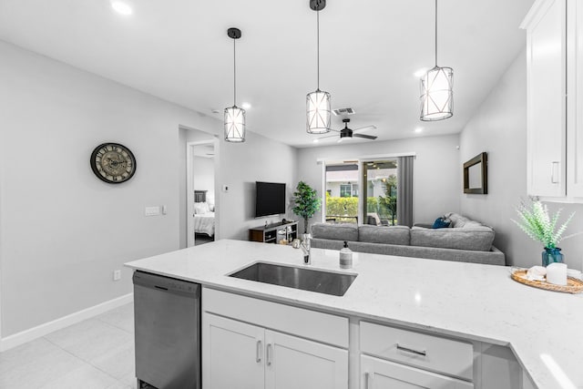 kitchen with white cabinets, stainless steel dishwasher, and sink