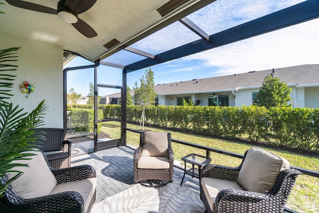 sunroom / solarium with ceiling fan