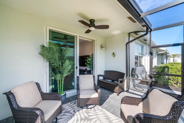 sunroom / solarium with ceiling fan and a wealth of natural light