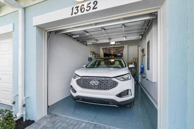 garage featuring a garage door opener