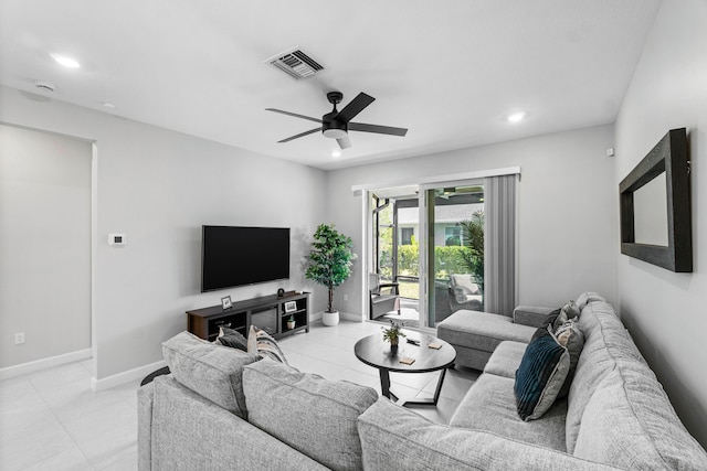 living room featuring recessed lighting, visible vents, baseboards, and light tile patterned flooring