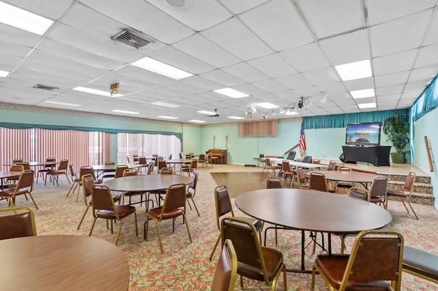 dining room with a paneled ceiling