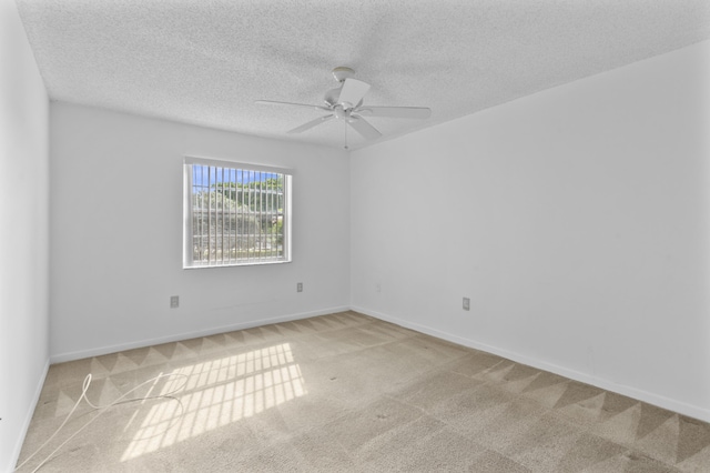 unfurnished room with light carpet, a textured ceiling, and ceiling fan