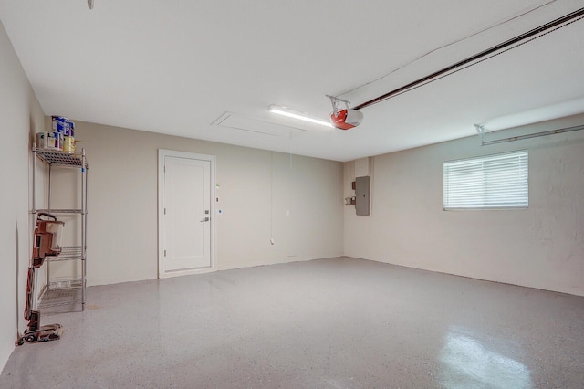 garage with electric panel and a garage door opener