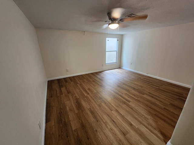 spare room featuring ceiling fan and wood-type flooring