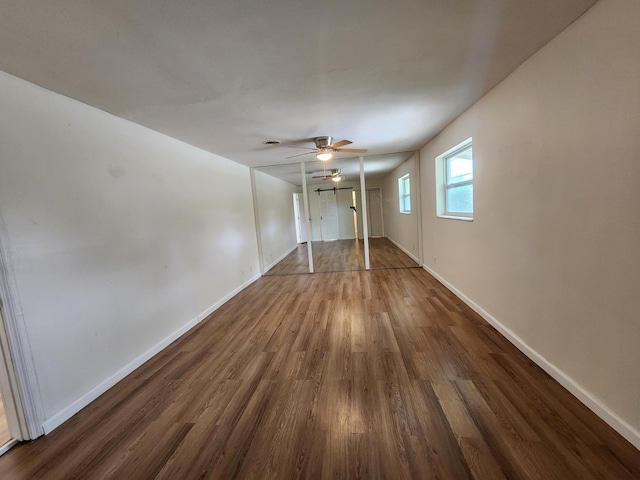 interior space with dark hardwood / wood-style floors and ceiling fan