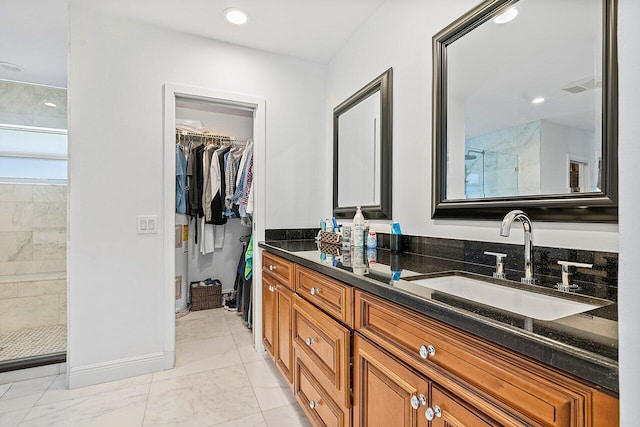 bathroom with vanity and walk in shower