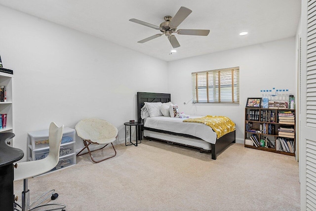 carpeted bedroom with ceiling fan