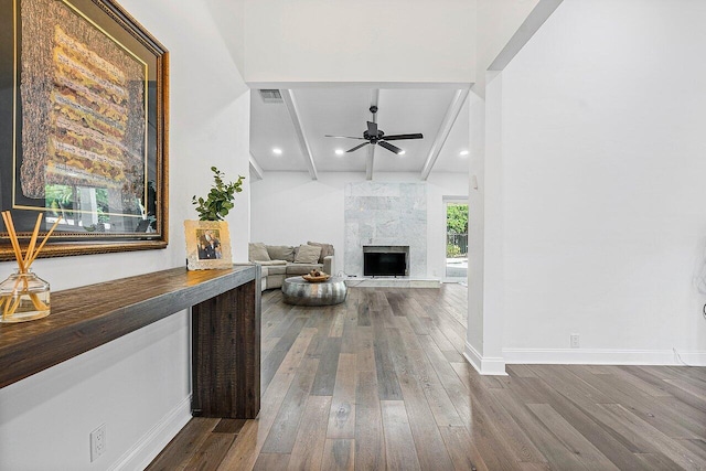 hall with beamed ceiling and hardwood / wood-style flooring