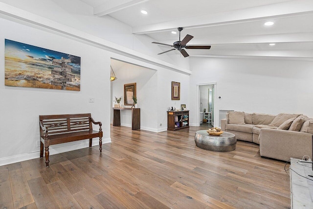 living room with hardwood / wood-style floors, ceiling fan, beam ceiling, and high vaulted ceiling