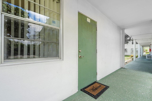 doorway to property featuring covered porch