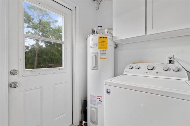 washroom featuring cabinets, washer / clothes dryer, and water heater