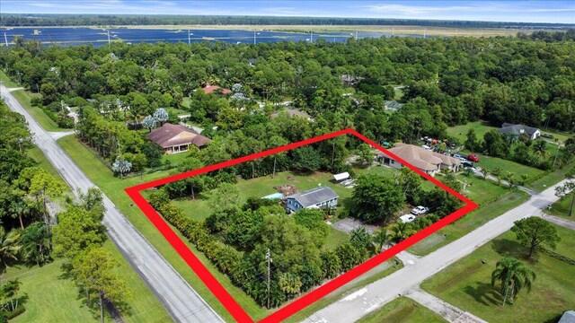 birds eye view of property with a water view