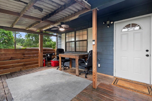 view of patio with ceiling fan and a deck