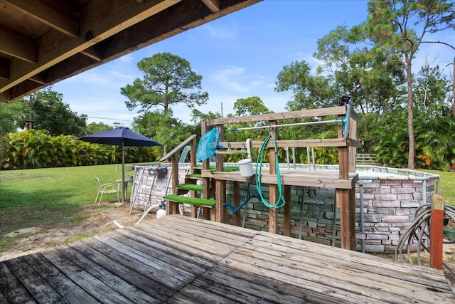 wooden terrace with a yard