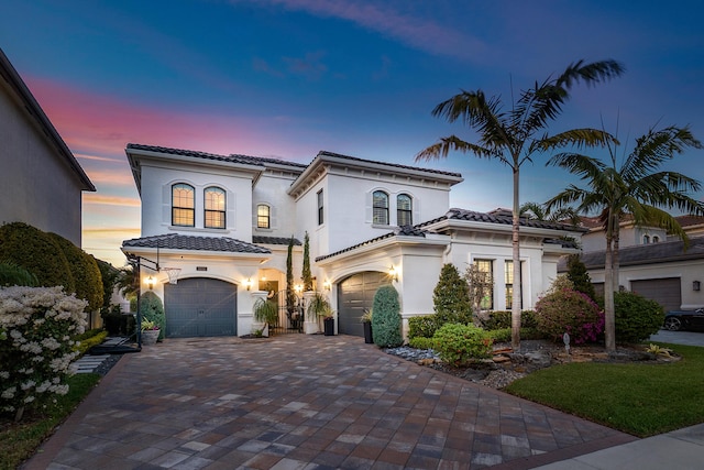 mediterranean / spanish-style house featuring a garage