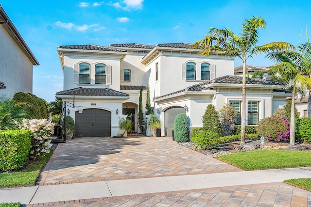 mediterranean / spanish-style home featuring a garage