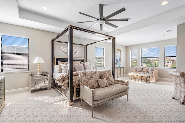 bedroom featuring light carpet and ceiling fan