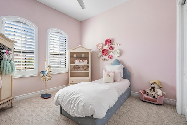 bedroom featuring ceiling fan and light colored carpet