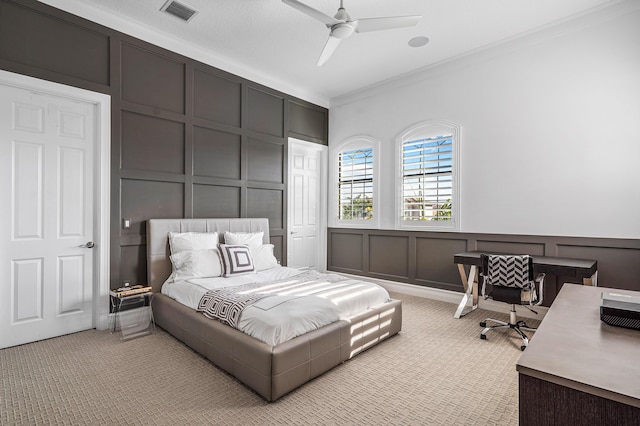 bedroom featuring ceiling fan and ornamental molding