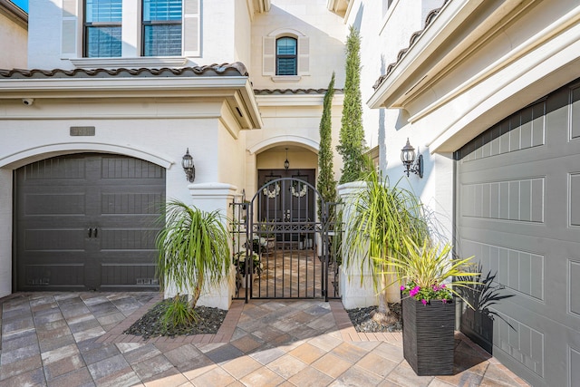 view of exterior entry featuring a garage