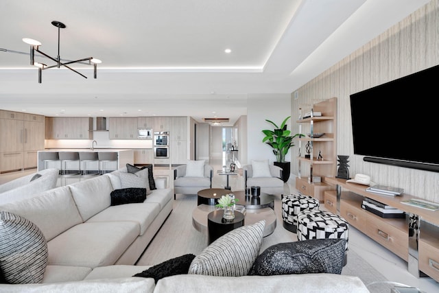 living room featuring a notable chandelier