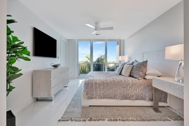 bedroom featuring ceiling fan, access to outside, and expansive windows