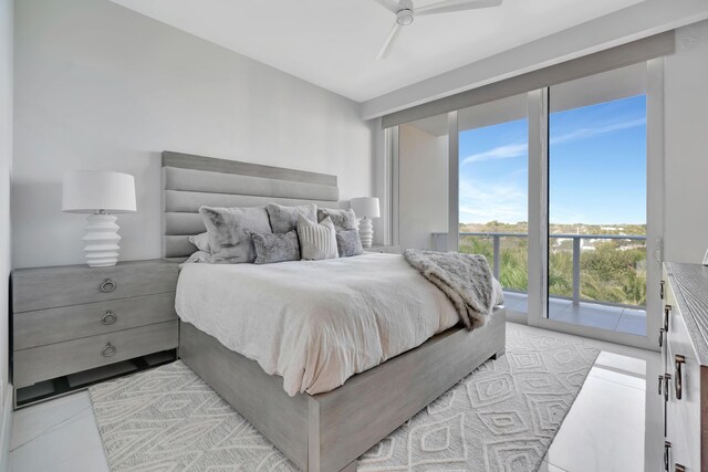 tiled bedroom with access to exterior and ceiling fan