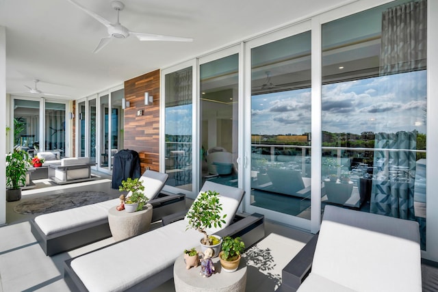 view of patio / terrace featuring ceiling fan and an outdoor living space