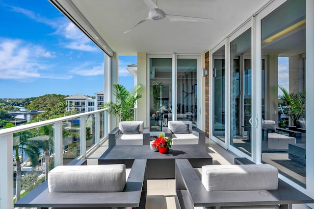 balcony featuring ceiling fan and an outdoor living space