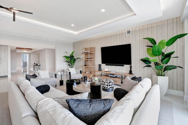 living room with a raised ceiling