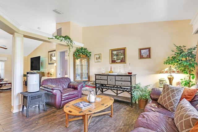 living room featuring dark hardwood / wood-style flooring and crown molding