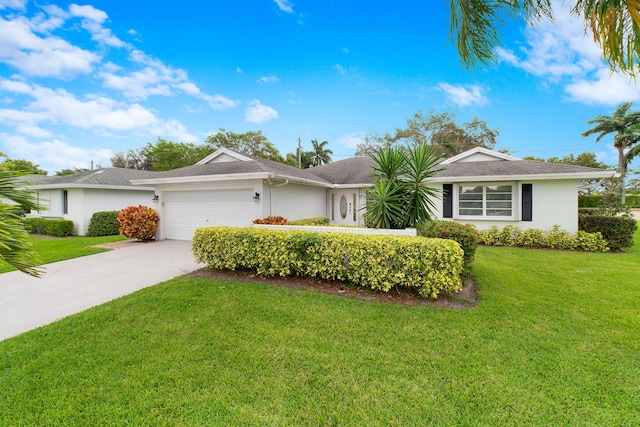 ranch-style home with a garage and a front yard