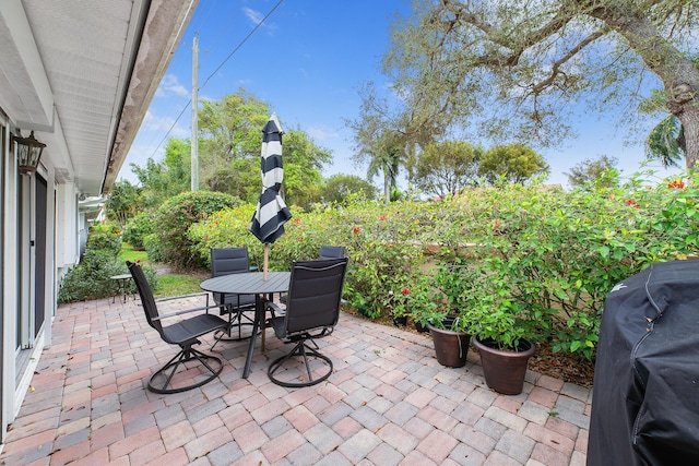 view of patio featuring a grill