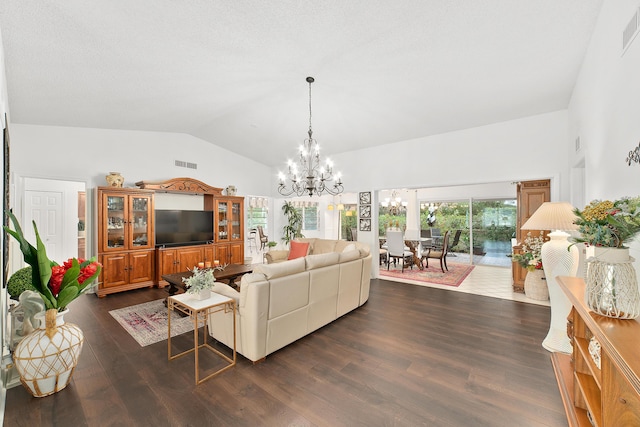 living room with dark hardwood / wood-style floors, a chandelier, and vaulted ceiling