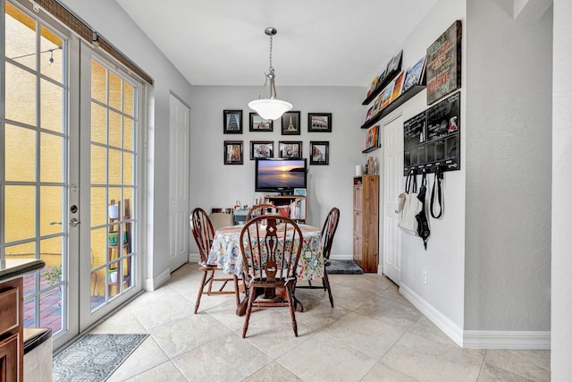 tiled dining room with french doors