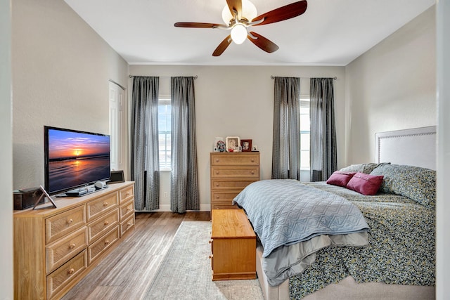 bedroom featuring ceiling fan and light wood-type flooring