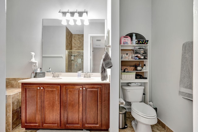 bathroom with a shower with door, vanity, and toilet