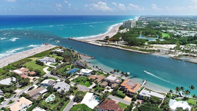 birds eye view of property with a view of the beach and a water view