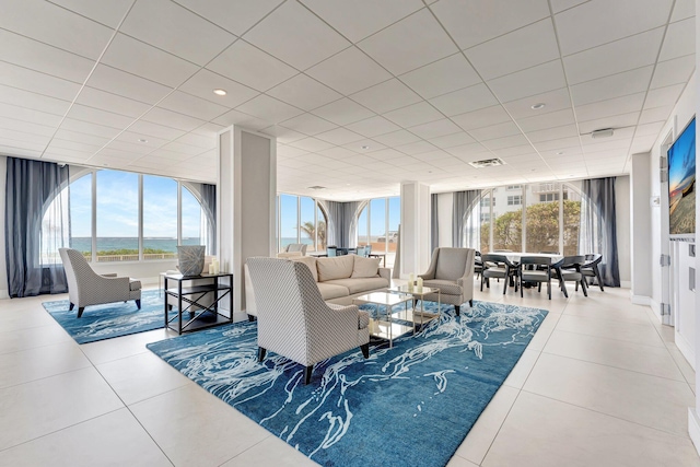 1180 S Ocean Blvd Unit 15B, Boca Raton, FL 33432 - living room featuring tile patterned floors, plenty of natural light, and a paneled ceiling